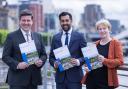 From left: SNP ministers Jamie Hepburn, Humza Yousaf, and Shona Robison with a paper on independence