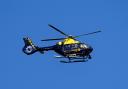A police helicopter photographed in flight above Glasgow in February 2023