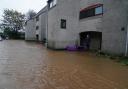 A man views flood water in Brechin