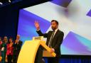 First Minister Humza Yousaf arrives on stage to deliver his speech during the SNP annual conference at the Event Complex Aberdeen