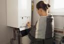 Is it realistic to expect homeowners to upgrade their heating systems at personal cost?