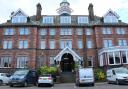 A far-right activist posed as an inspector to obtain information about a Dumfries hotel