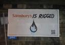 Campaigners replaced billboards across Glasgow to take aim at Sainsbury's