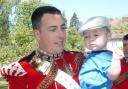 Murdered soldier Lee Rigby pictured with his son. Rigby's widow Rebecca has urged for an end to anti-Muslim hate