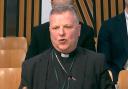 Bishop John Keenan was told to desist from comparing prayer vigils outside abortion clinics to demonstrations at Faslane by MSPs
