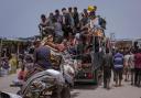 Palestinians flee from Rafah during an Israeli ground and air offensive as at least 36,000 people have been killed