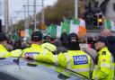 Garda watch protesters on O'Connell Street in Dublin