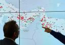 Image showing officials tracking ship movements in the Strait of Hormuz