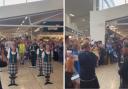 Fans belted out Flower of Scotland while waiting to board flights to the US at Edinburgh Airport