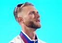 Josh Kerr of Scotland, gold medal winner, in tears as Flower of Scotland plays during the medal ceremony for the Men's One Mile final