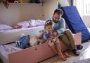 Mohammad and his daughter read a book in English together. While she was born in Scotland she is still learning how to read and write in both English and Arabic