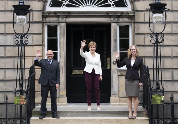 The National: First Minister Nicola Sturgeon (centre) welcoming Scottish Green co-leaders Patrick Harvie and Lorna Slater at Bute House