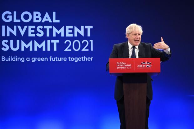The National: Boris Johnson delivers a speech during the Global Investment Summit