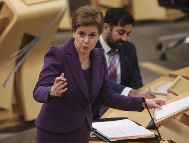 The National: First Minister Nicola Sturgeon updates MSPs on any changes to the Covid-19 restrictions in the debating chamber of the Scottish Parliament in Edinburgh. Picture date: Tuesday November 16, 2021. PA Photo. See PA story SCOTLAND Coronavirus . Photo credit
