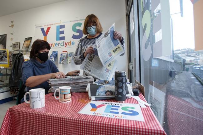 Members of Yes Inverclyde, Sandra Reynolds, left and Mary McGlashan at right pictured at their base in Greenock sorting copies of The National's eight page pro-independence supplement that they are delivering to homes across Inverclyde