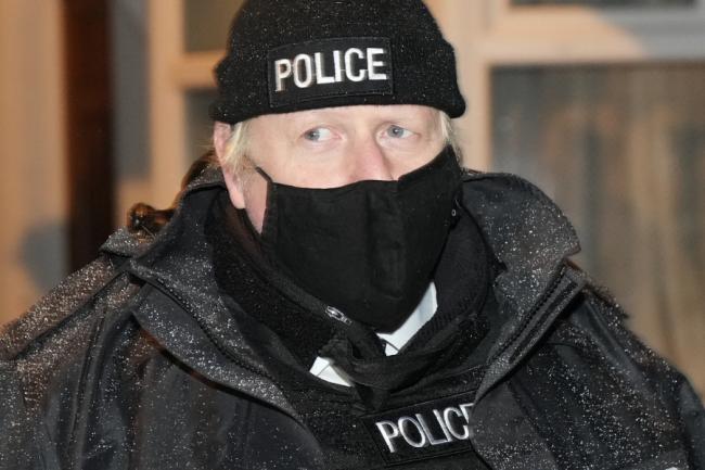 Boris Johnson was seen 'playing dress up' as a police officer on Monday