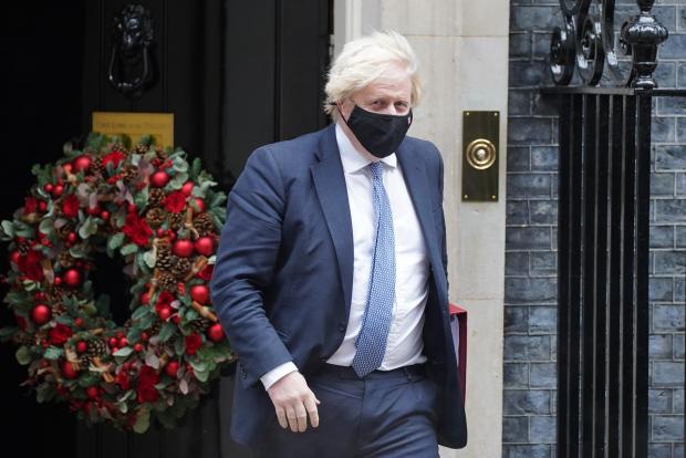 The National: Johnson pictured outside of Downing Street during the festive period