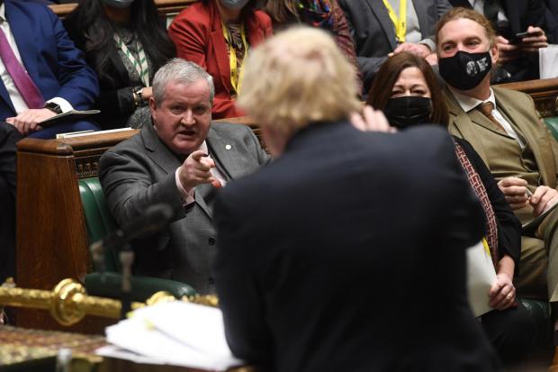 The National: SNP Westminster leader Ian Blackford pointing at Prime Minister Boris Johnson during Prime Minister's Questions in the House of Commons, London on Wednesday December 8, 2021. 