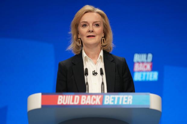 The National: MANCHESTER, ENGLAND - OCTOBER 03: Foreign Secretary Liz Truss delivers a speech on day one of the annual Conservative Party Conference at Manchester Central on October 03, 2021 in Manchester, England. This year's Conservative Party Conference returns