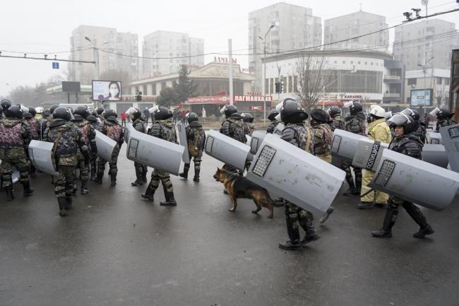 Riot police gather to block demonstrators during a protest in Almaty, Kazakhstan on Wednesday