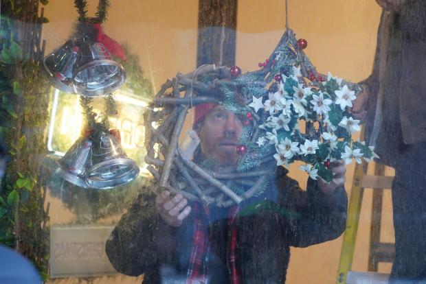 The National: Christmas decorations have been hung in a shop window (Andrew Milligan/PA)
