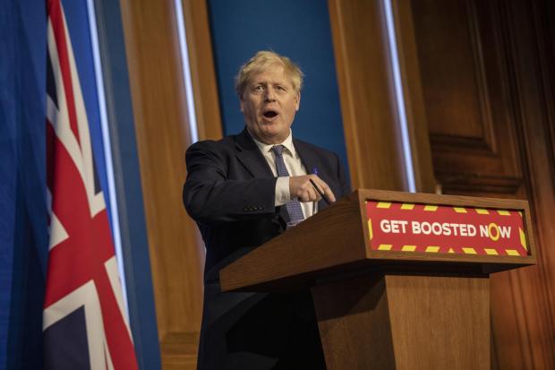 The National: LONDON, ENGLAND - JANUARY 04: Britain's Prime Minister Boris Johnson gestures, during a coronavirus briefing at Downing Street on January 4, 2022 in London, England. The Prime Minister announced that around 100,000 critical workers would be set to