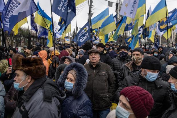 The National: KYIV, UKRAINE - JANUARY 28: Supporters of Ukraine's former President, Petro Poroshenko listen to speeches and chant slogans while waiting for Petro Poroshenko to arrive outside the Kyiv District Court of Appeal on January 28, 2022. Poroshenko is