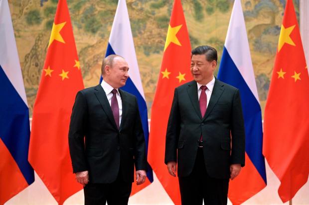 The National: Chinese President Xi Jinping, right, and Russian President Vladimir Putin (Alexei Druzhinin/AP)