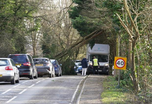 The National: A fallen tree blocks a road in Eynsham in Oxfordshire due to Storm Eunice. Picture: PA