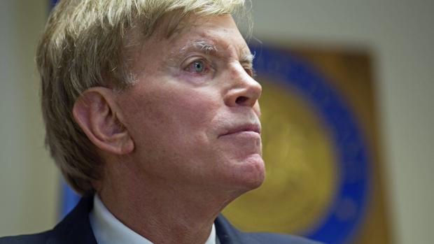 The National: Former Ku Klux Klan leader David Duke talks to the media at the Louisiana secretary of state's office in Baton Rouge, La., on July 22, after registering to run for the U.S. Senate. "The climate of this country has moved in my direction,"