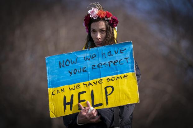 A woman at the Scotland Stands with Ukraine peace rally  outside the Scottish Parliament in March 2022