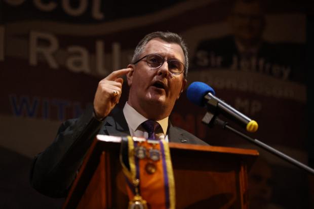 The National: DUP leader Sir Jeffrey Donaldson speaks during an anti Northern Ireland Protocol rally and parade in late March