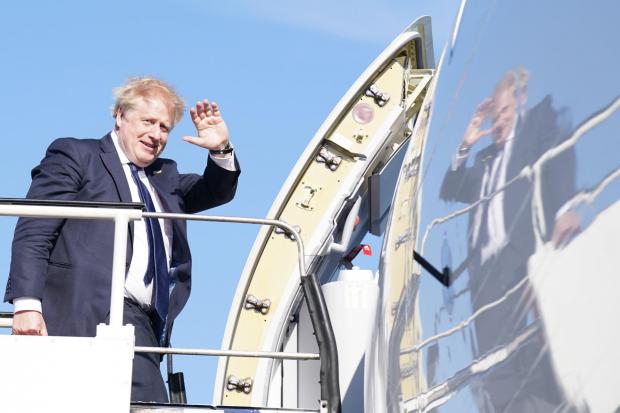 The National: Boris Johnson boards aircraft