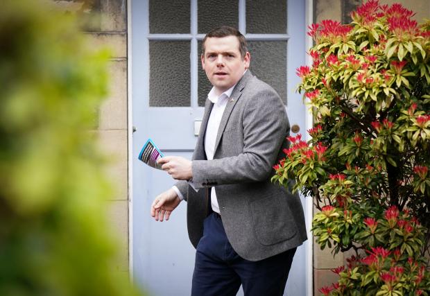 The National: Scottish Conservative leader Douglas Ross in Davidson Mains, Edinburgh, on the campaign trail