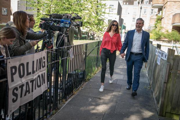 The National: Keir Starmer arrives at the polling station with his wife Victoria 