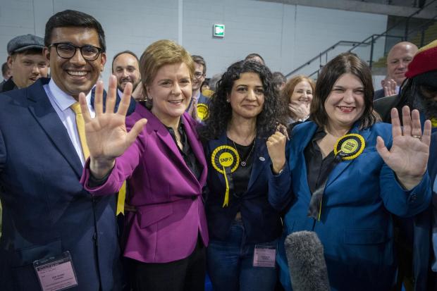 The National: Nicola Sturgeon celebrates with elected SNP councillors at the Glasgow count