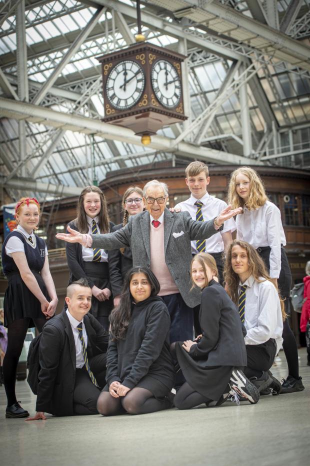 The National: Henry Wuga with pupils from Shawlands Academy