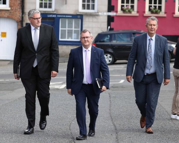 The National: Gavin Robinson, Jeffrey Donaldson and Edwin Poots of the DUP arrive at Hillsborough Castle