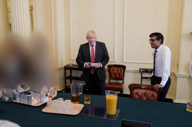 The National: Johnson and Sunak pictures at the PM's surprise birthday party in the cabinet room