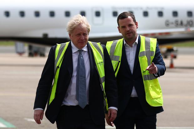 The National: Johnson, left, with Holmes, right, on the local election campaign trail in May