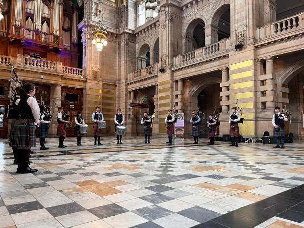 The National: The National Youth Pipe Band of Scotland playing the Ukrainian and Scottish national anthems at Kelvingrove Art Gallery