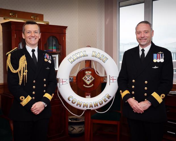 The National: Commodore Bob Anstey, right, being handed over command of HM Naval Base Clyde 