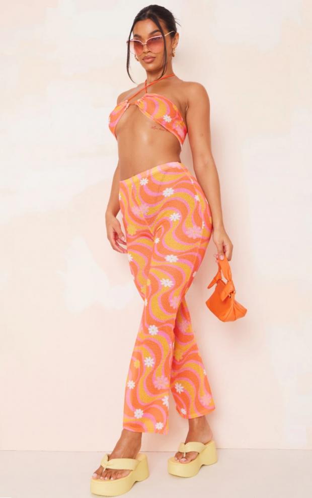 The National: Orange Flower Swirl Print Knit Flare Trousers (PrettyLittleThing)