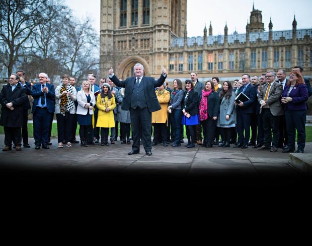 The National: Ian Blackford with SNP MPs in Westminster, London after the party won 47 seats in Scotland in the general election. PRESS ASSOCIATION Photo. Picture date: Monday December 16, 2019. See PA story POLITICS SNP. Photo credit should read: Aaron Chown/PA Wire.