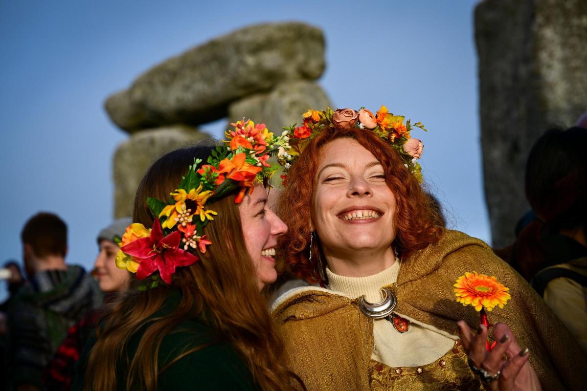 People gather for sunrise at Stonehenge on the summer solstice
