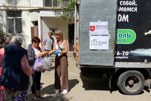 The National: Volunteers V2’s Vika Vorobiova hands out food and other essentials