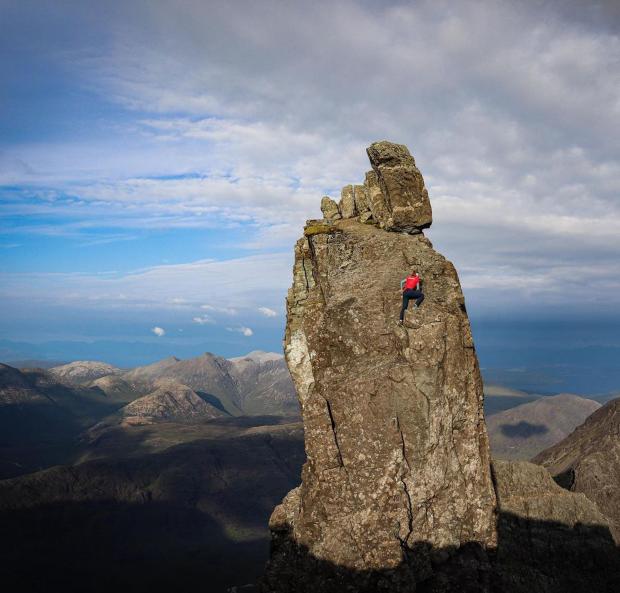 The National: The adventure see the Cumbrian climber make her way up mountain crags across the country