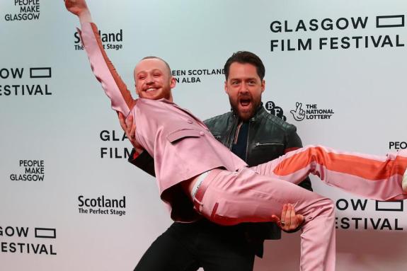 The National: John Bell (being lifted up by co-star Richard Rankin) was hailed for his commitment to learning Gaelic The National: John Bell (being lifted up by co-star Richard Rankin) was hailed for his commitment to learning Gaelic