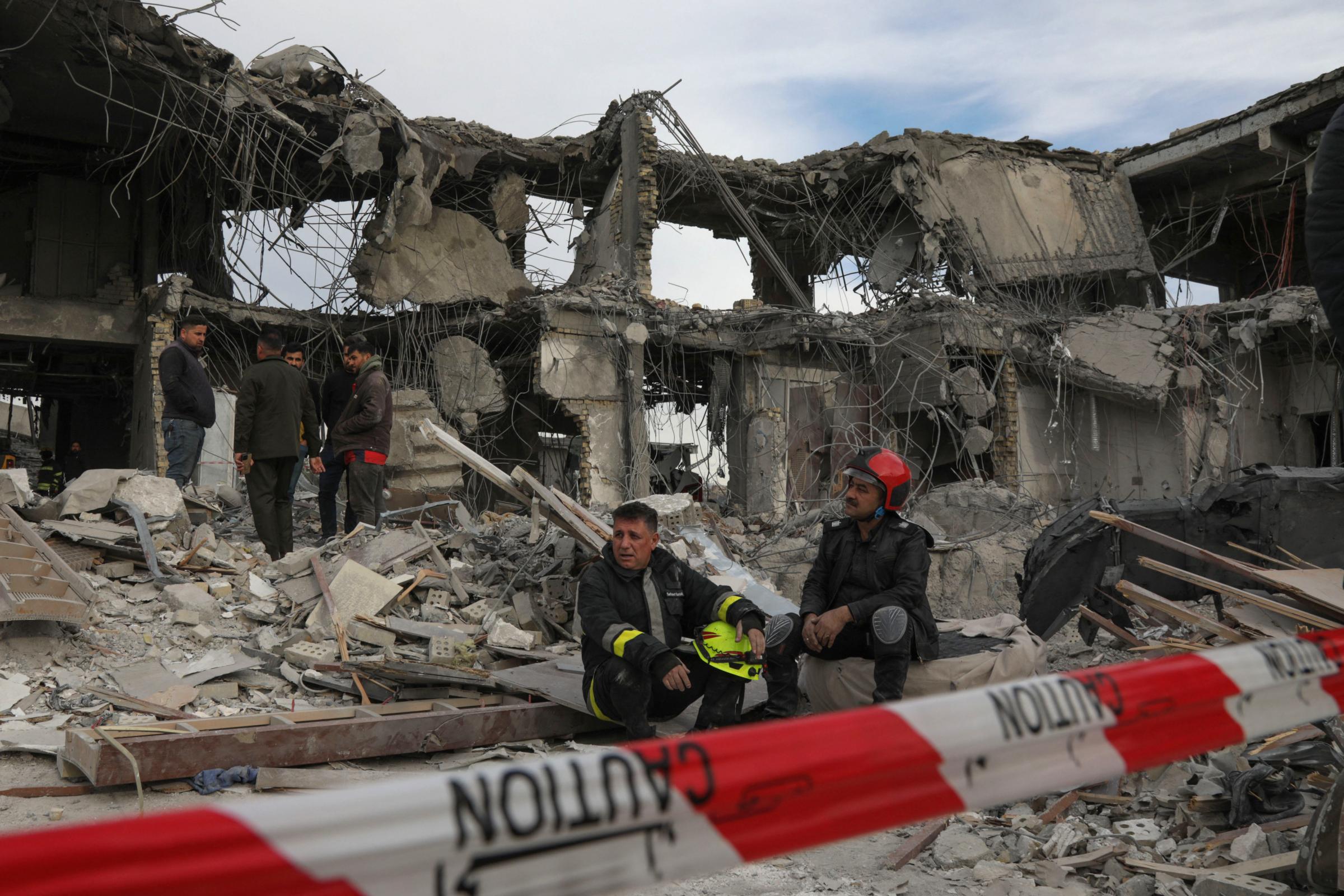 TOPSHOT - A civil defence team carries out search and rescue operations in a damaged building following a missile strike launched by Irans Revolutionary Guard Corps (IRGC) on the Kurdistan regions capital of Arbil, on January 17, 2024. The IRGC have