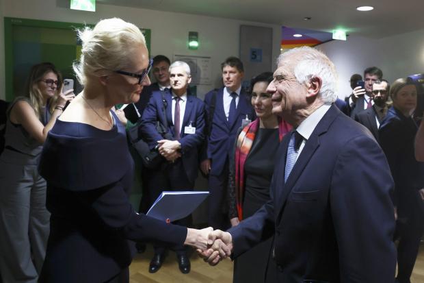 Yulia Navalnaya, widow of Russian opposition leader Alexei Navalny, left, shakes hands with European Union foreign policy chief Josep Borrell